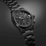 Seiko stylish black stainless steel watch with luminescent dial and date display, water-resistant.