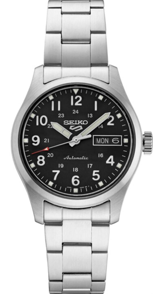 Silver-toned Seiko automatic watch with black dial, Arabic numerals, day-date display, and stainless steel bracelet.