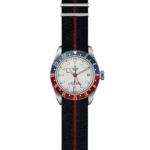 Tudor watch with rotating bezel, fabric strap, and elegant white face, perfect for any occasion.