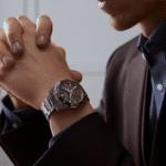 Sophisticated man’s watch in a thoughtful pose, showcasing elegance and luxury in a formal setting.