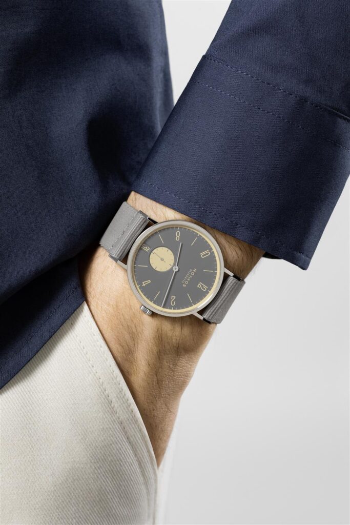 Stylish mens wristwatch with grey dial and elegant strap, perfect for contemporary fashion.