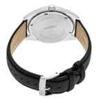 Elegant Seiko watch with polished stainless steel case and black leather strap, showcasing refined craftsmanship.