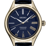 Elegant Seiko Presage watch with blue dial, gold accents, and leather strap, showcasing fine craftsmanship.