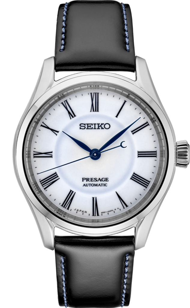 Elegant Seiko Presage automatic watch with silver stainless steel case and black leather strap.