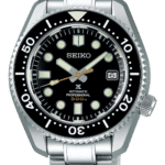 Seiko diving watch with black dial, stainless steel case, and luminescent markers for visibility.
