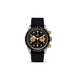 Tudor chronograph watch features a black dial, gold accents, and a textured black strap.