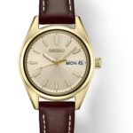 Elegant Seiko gold-toned watch with leather strap, minimalist design, and date display.