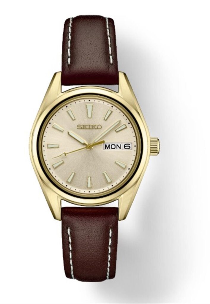 Elegant Seiko gold-toned watch with leather strap, minimalist design, and date display.