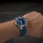 Stylish ORIS wristwatch with a blue dial and stainless steel case, ideal for adventures.