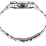 Sleek luxury wristwatch with polished metal case, blue crown gem, and interlocking bracelet design.