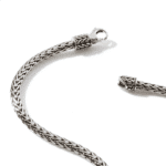 Intricate sterling silver woven chain jewelry featuring an ornate clasp, highlighting exquisite craftsmanship.
