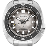 Seiko divers watch with stainless steel case, 200m water resistance, and textured gray dial.