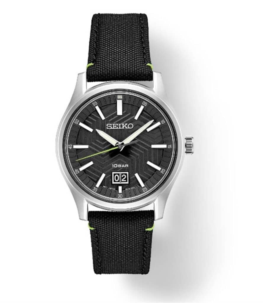 Modern black dial watch with textured design, metallic accents, and durable fabric strap.