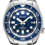 Seiko dive watch featuring a blue dial, stainless steel case, and luminous hands for visibility.
