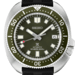 Seiko divers watch with stainless steel case, green bezel, and rubber strap for ocean adventures.