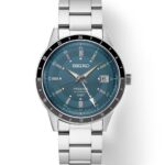Elegant Seiko Presage GMT watch with teal dial, stainless steel case, and date function.