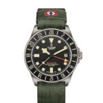 Tudor Pelagos GMT dive watch with titanium case, black dial, and green fabric strap.