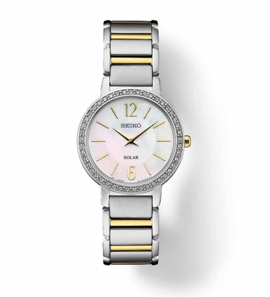 Elegant Seiko solar watch with sparkling stones, iridescent dial, and dual-tone strap.
