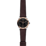 Tudor luxury watch with rose gold bezel, black dial, and brown leather strap for elegant style.