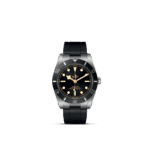 Tudor diving watch features stainless steel case, black dial, and rubber strap for underwater adventures.