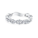 Elegant white metal ring with intricate diamond motif, perfect for special occasions.