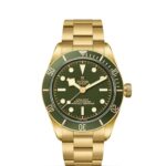 Luxurious Tudor watch featuring a vibrant green dial and elegant gold-tone case and bracelet.