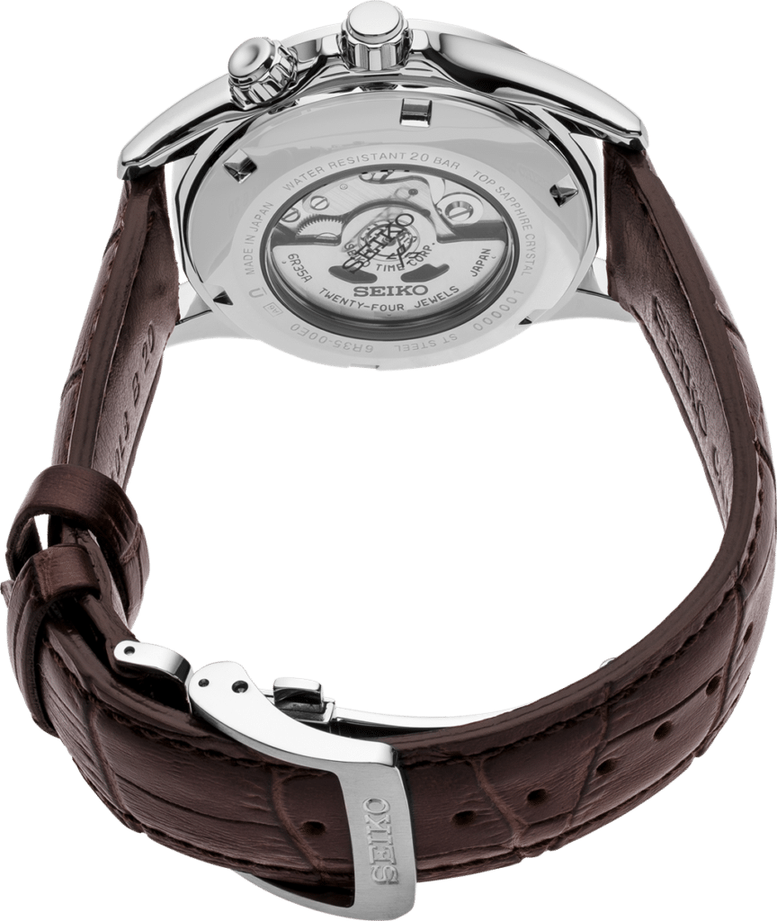 Elegant Seiko watch with stainless steel case, leather strap, and transparent case back showcasing intricate movement.