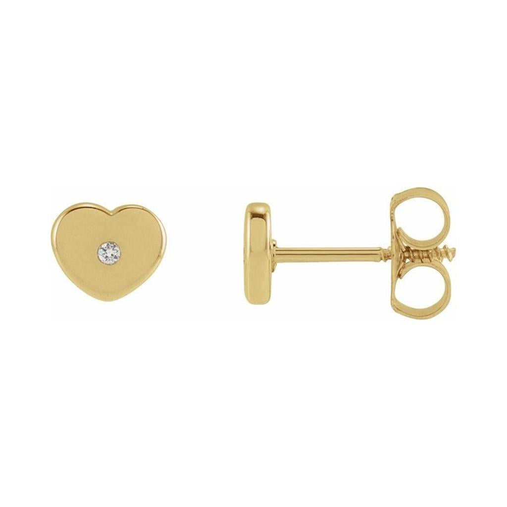 Elegant heart-shaped gold earrings with sparkling gemstone, perfect for gifts and everyday wear.