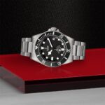 Tudor diving watch with elegant design on a stylish background, showcasing luxury and craftsmanship.