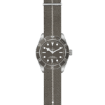 Elegant Tudor divers watch with brown dial, stainless steel case, and durable fabric strap.