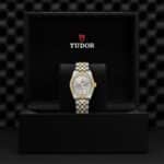 Elegant Tudor watch in luxury display box showcasing craftsmanship and sophisticated design.