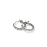 Elegant silver hoop earrings with sparkling embellishments for casual and formal wear.