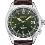 Elegant Seiko watch with green dial, gold accents, stainless steel case, and brown leather strap.