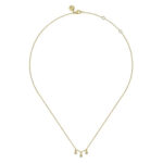Elegant gold necklace with sparkling drops, perfect for casual and formal occasions.