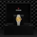 Tudor luxury watch displayed in an elegant black box, highlighting its exquisite design and craftsmanship.