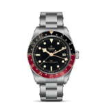 Tudor GMT Master Chronometer watch features a black dial, red and black bezel, and stainless steel bracelet.
