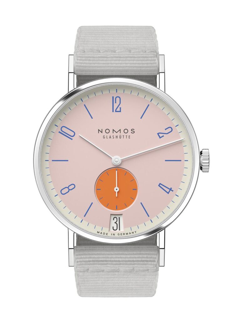 Elegant Nomos Glashütte watch with pink dial, stainless steel case, and gray textile strap.