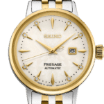 Elegant Seiko Presage automatic watch with gold and silver tones, sparkling gemstones, and sophisticated design.
