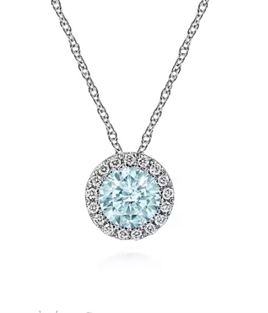 Elegant light blue gemstone necklace with a diamond halo, perfect for any occasion.