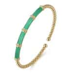 Elegant jade and gold bracelet with a modern open design, perfect for casual or formal wear.