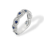 Elegant silver ring with blue sapphires and sparkling accents, perfect for special occasions.