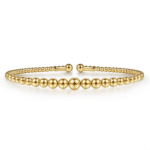 Elegant gold bracelet with intricate beads, perfect for any occasion or layered jewelry looks.