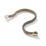 Elegant serpentine bracelet in silver and gold, showcasing intricate craftsmanship and modern design.