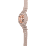 Stylish G-Shock watch in beige and rose gold, perfect for casual and formal wear.