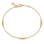 Elegant gold bracelet with spherical beads, perfect for layering or solo wear.