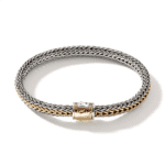 Elegant silver and gold-toned braided bracelet with a stylish clasp, perfect for any occasion.