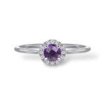Elegant purple gemstone ring with a sparkling halo of white stones in a luxurious setting.