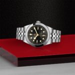 Luxury stainless steel watch with a black dial, luminous features, and a stylish bracelet.