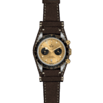 Luxury Tudor watch with gold dial, chronograph features, and brown leather strap.