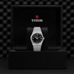 Luxurious Tudor watch displayed in elegant black presentation box, showcasing superior craftsmanship and style.